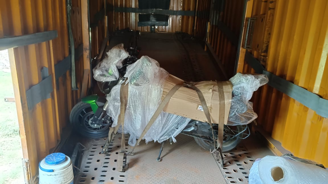 Vehicle packed and prepared inside enclosed carrier