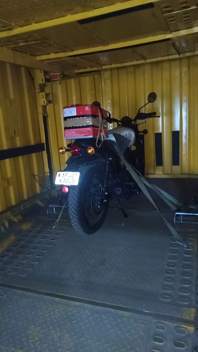 Bike secured on transport carrier for two-wheeler transportation